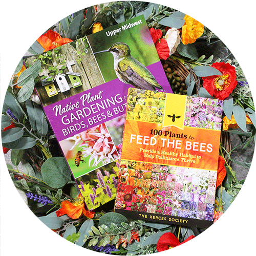 Two books about gardening for pollinators laying on a flower wreath.